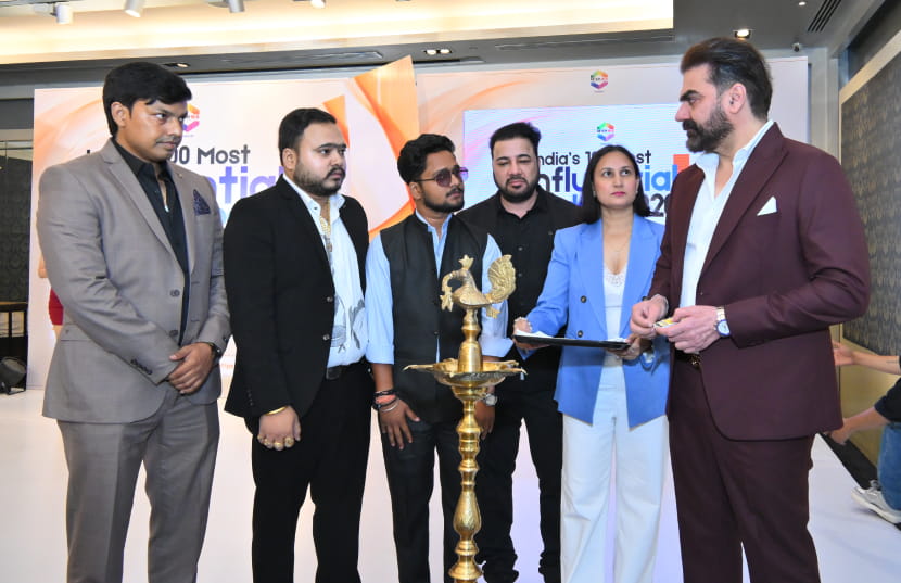Indian entrepreneur receiving a business award on stage